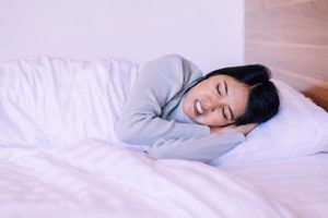 woman struggling with teeth grinding