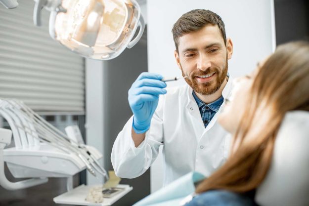 a man addresses a dental emergency