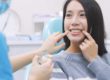 woman learning about a dental implant