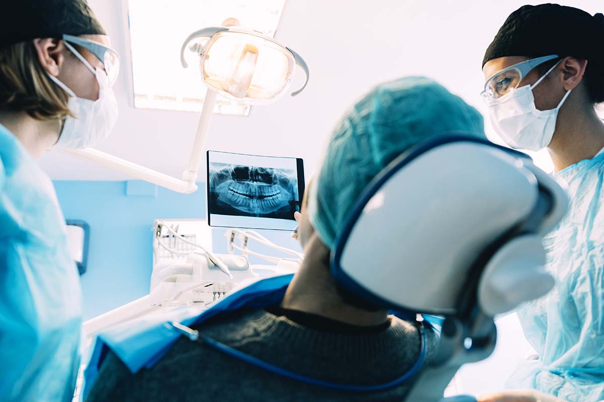 dentists discussing oral surgeries