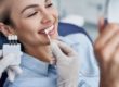 a woman sees the benefits of dental veneers